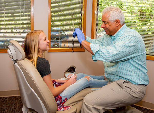 Dr. Schur working with an actual patient at his Redmond area orthodontics office.