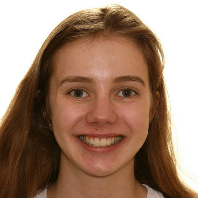 Smiling young girl straight smile from orthodontic treatment.